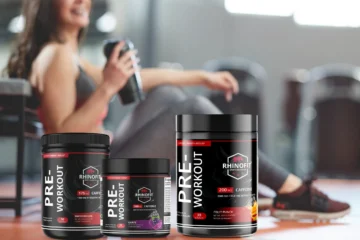 Image of a woman taking pre-workout supplements before her workout